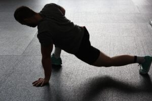 monochrome image of man stretching 